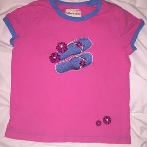 Cute pink tee with flip flops on front of tee